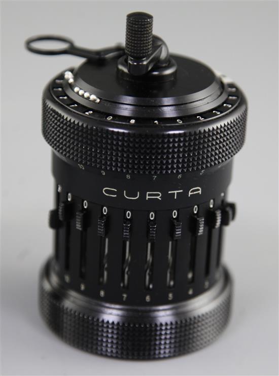 A Contina Ltd Curta Mechanical Calculator, calculator height 4.5in.